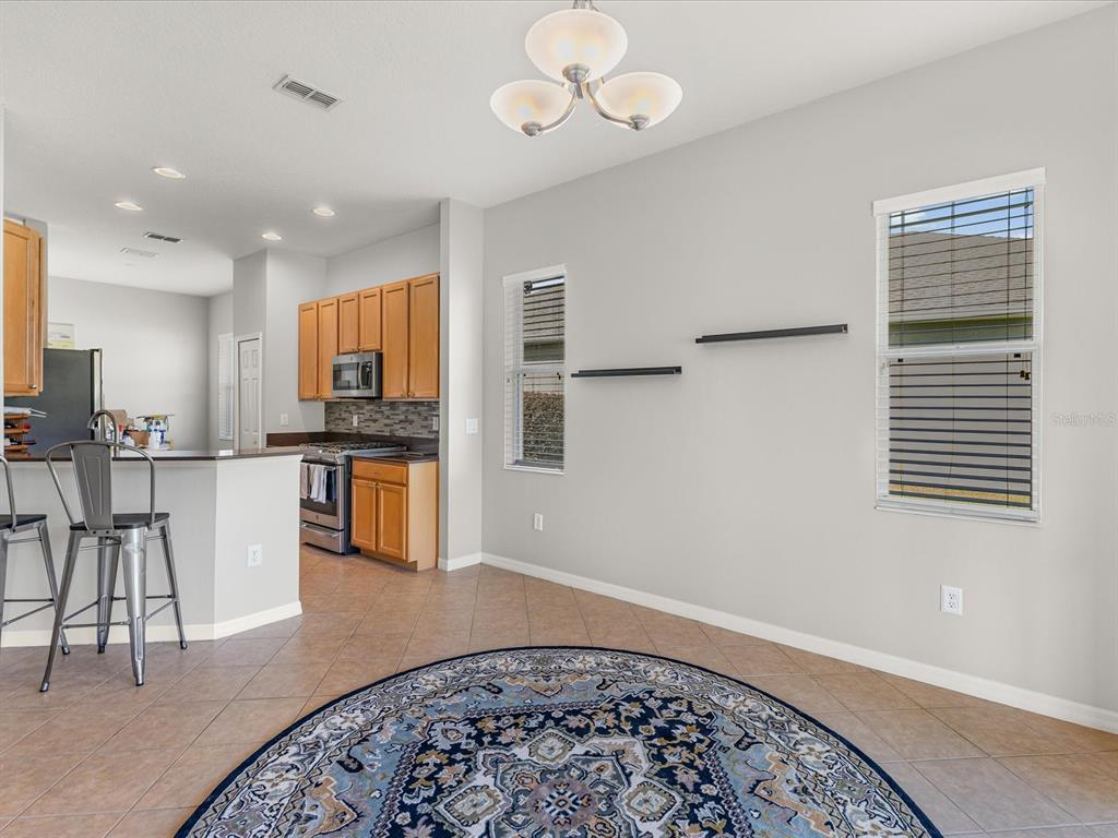 5347 Cappleman Loop Brooksville, FL 34601 - Photo 7 of 28 a view of kitchen with granite countertop window and white appliances