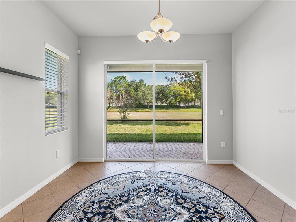 5347 Cappleman Loop Brooksville, FL 34601 - Photo 9 of 28 an empty room with a window and ceiling fan