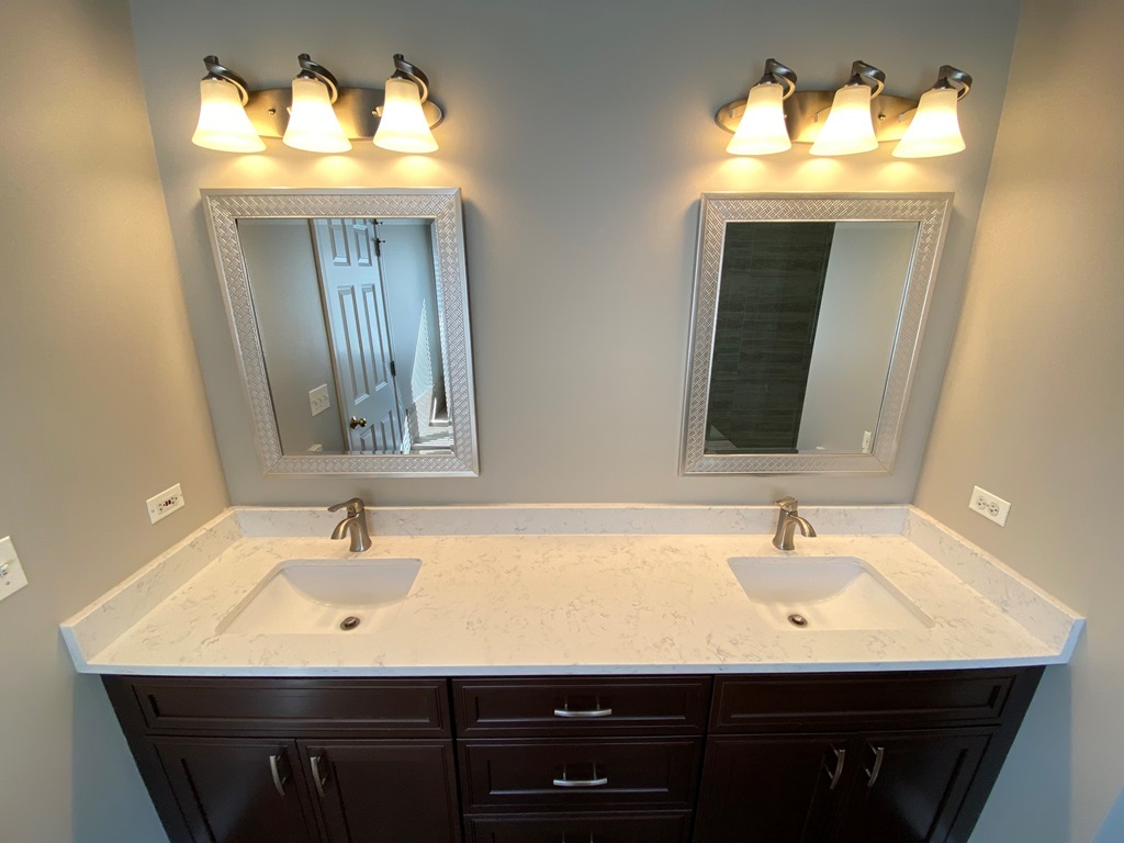 2428 Ridgewood Court Aurora, IL 60502 - Photo 19 of 39 a bathroom with a sink and a mirror