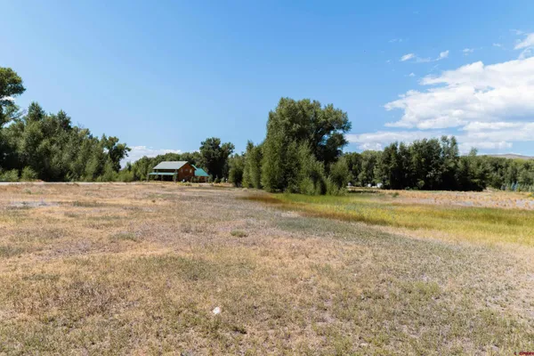 a view of a lake with a yard