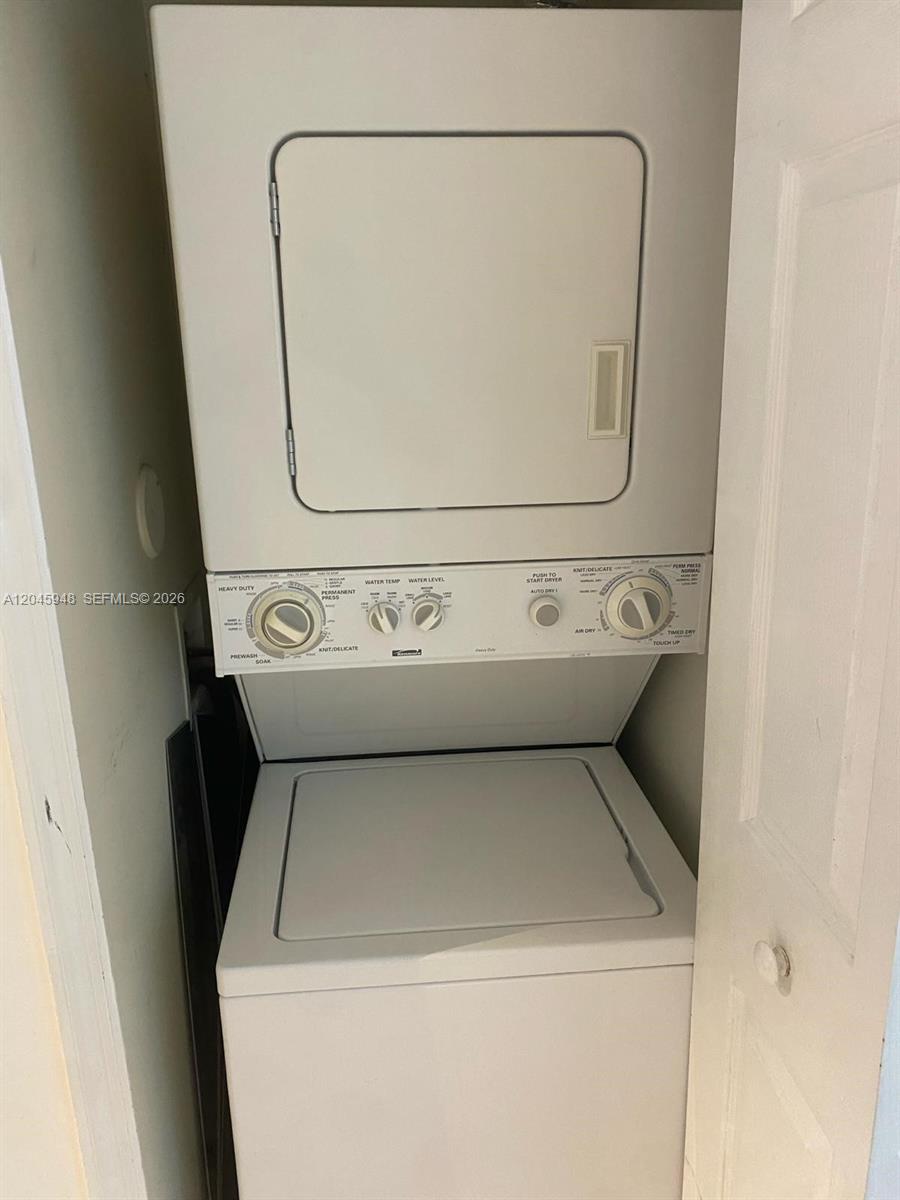 5612 Rock Island Road, Unit 167 Tamarac, FL 33319 - Photo 6 of 16 a utility room with dryer and washer