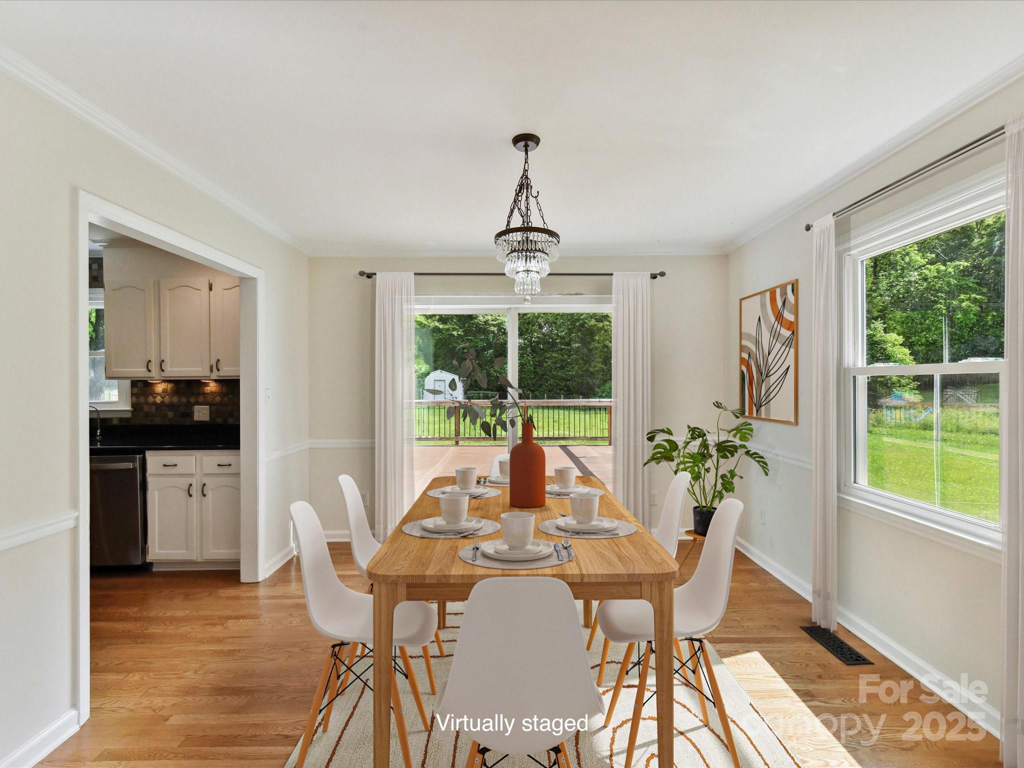 915 Gate Road Monroe, NC 28112 - Photo 13 of 46 a dining room with furniture window and wooden floor