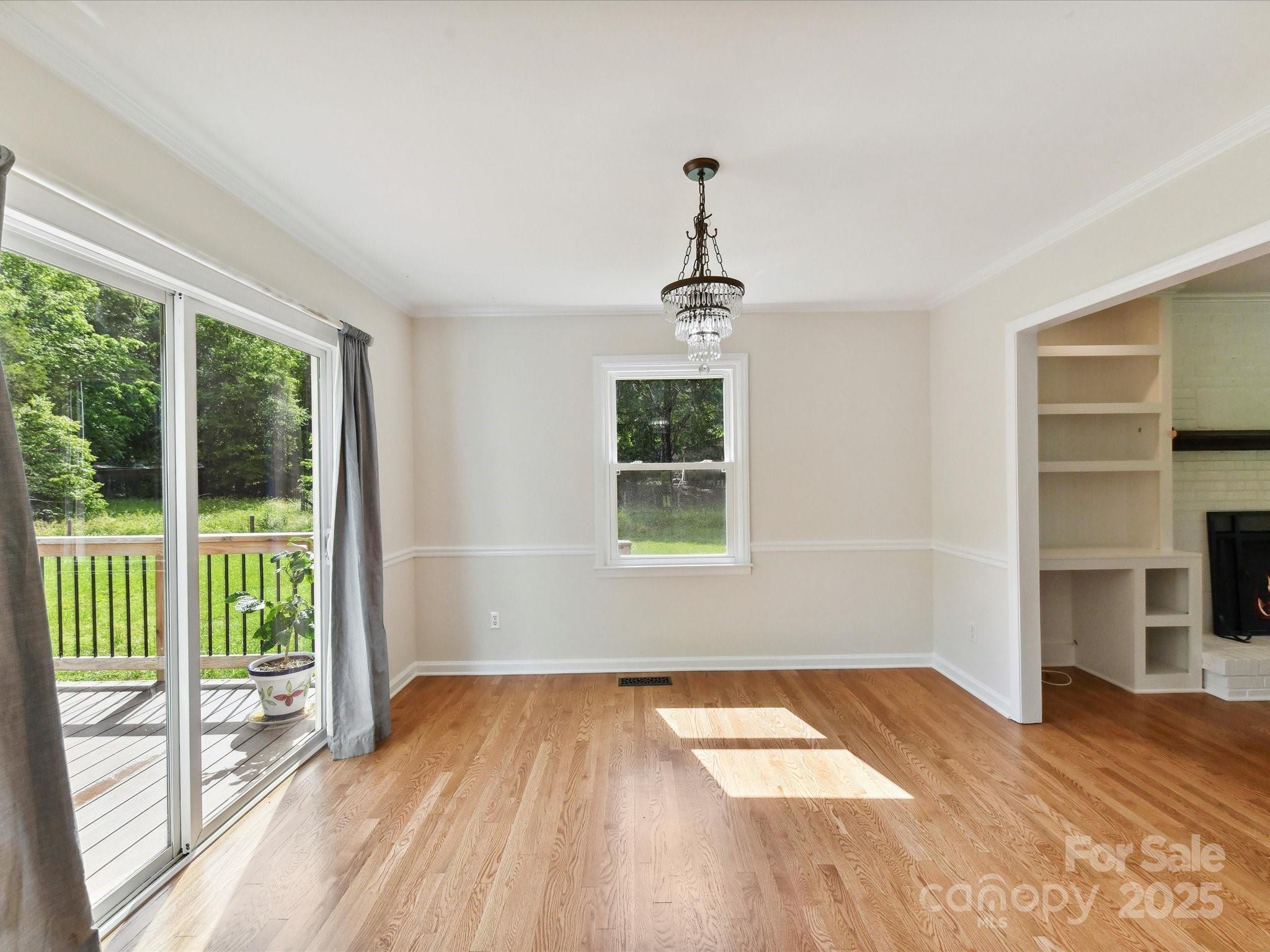 915 Gate Road Monroe, NC 28112 - Photo 15 of 46 a view of empty room with wooden floor and fan