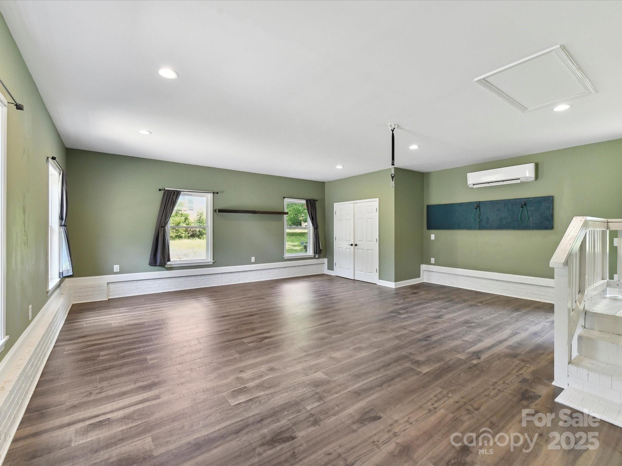 915 Gate Road Monroe, NC 28112 - Photo 23 of 46 a view of an empty room with window and wooden floor
