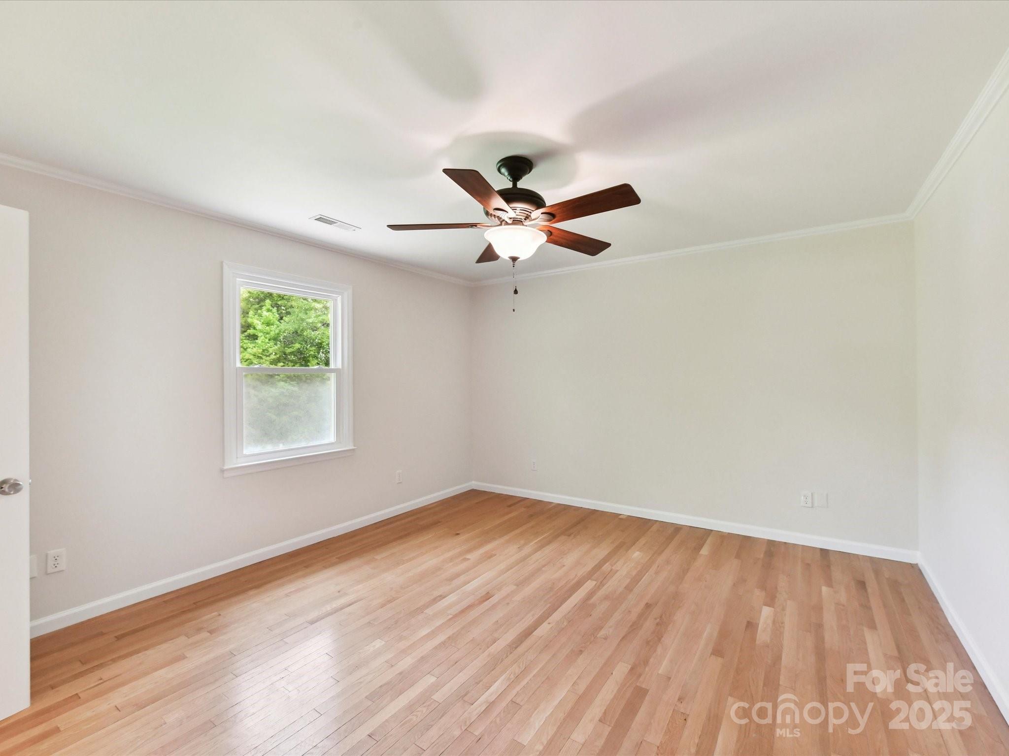 915 Gate Road Monroe, NC 28112 - Photo 25 of 46 wooden floor in an empty room with a window