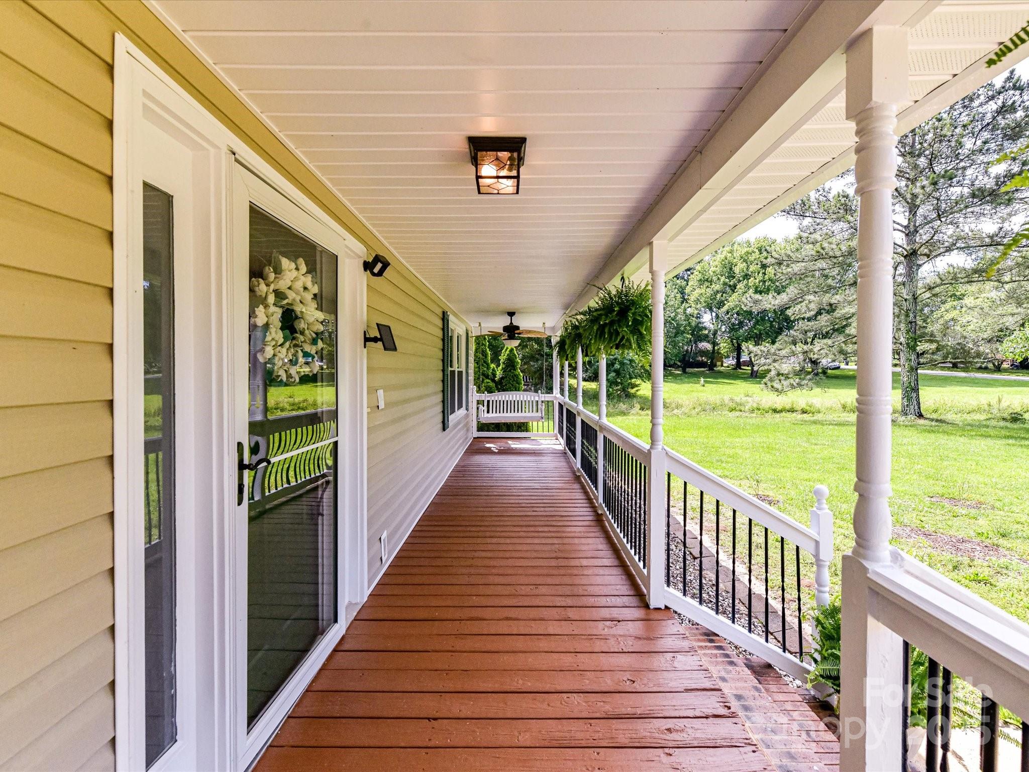 915 Gate Road Monroe, NC 28112 - Photo 4 of 46 a view of a porch with wooden floor and outdoor space
