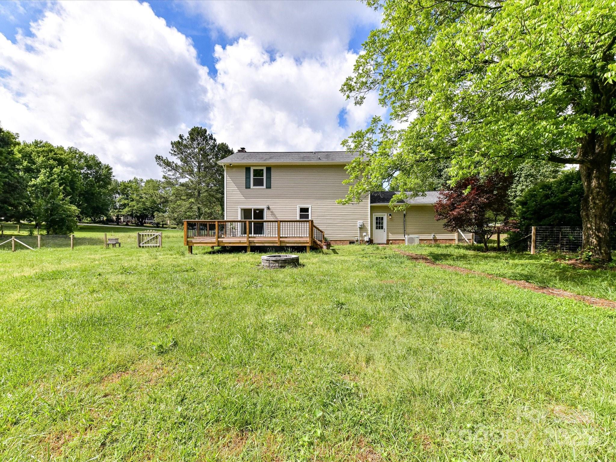 915 Gate Road Monroe, NC 28112 - Photo 41 of 46 a view of a house with backyard and sitting area