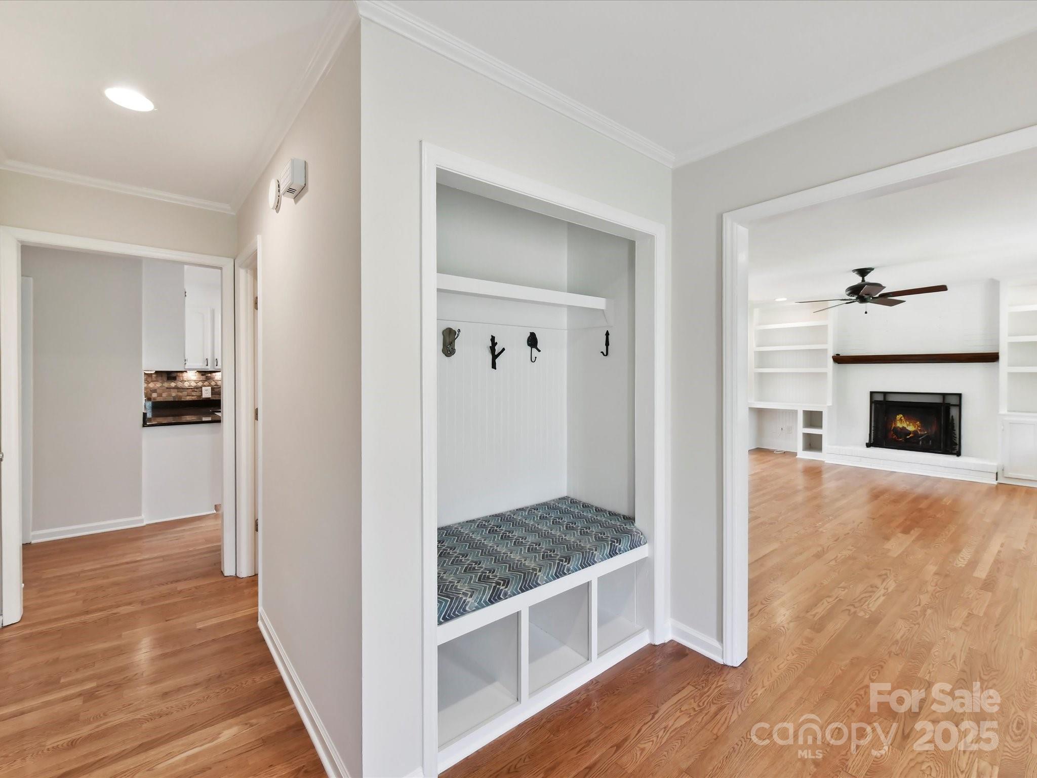 915 Gate Road Monroe, NC 28112 - Photo 8 of 46 a view of a hallway with wooden floor and a living room