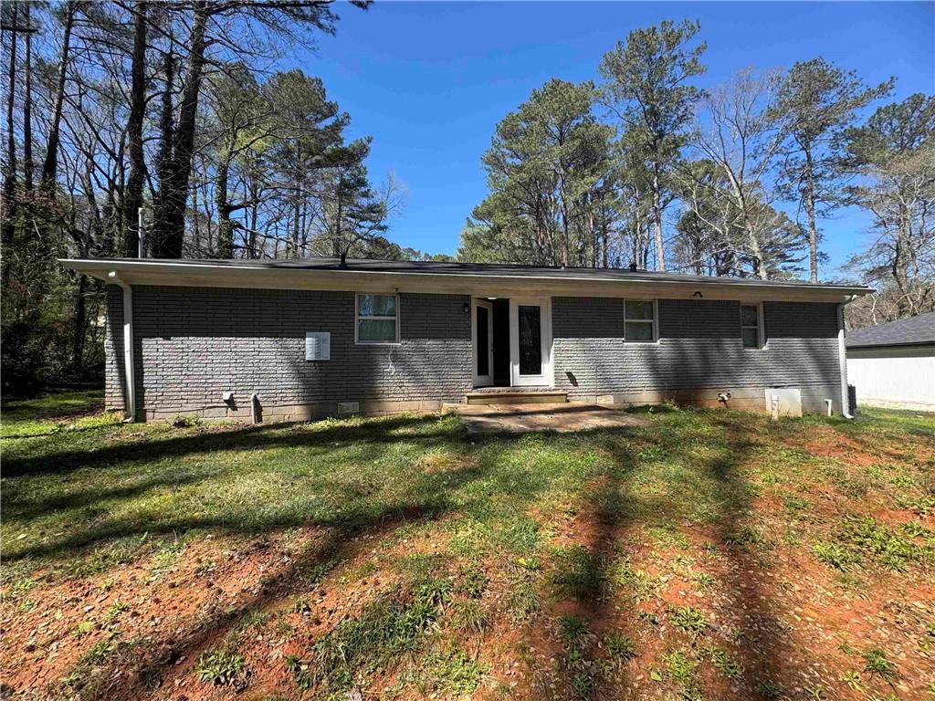 2536 Butner Road Atlanta, GA 30331 - Photo 5 of 19 a front view of a house with garden