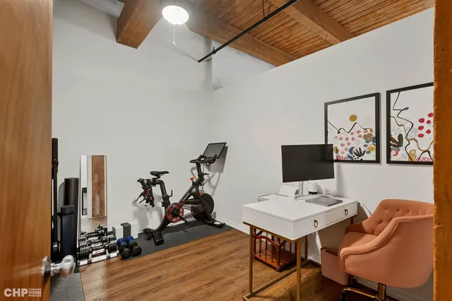 a view of a livingroom with furniture and a flat screen tv