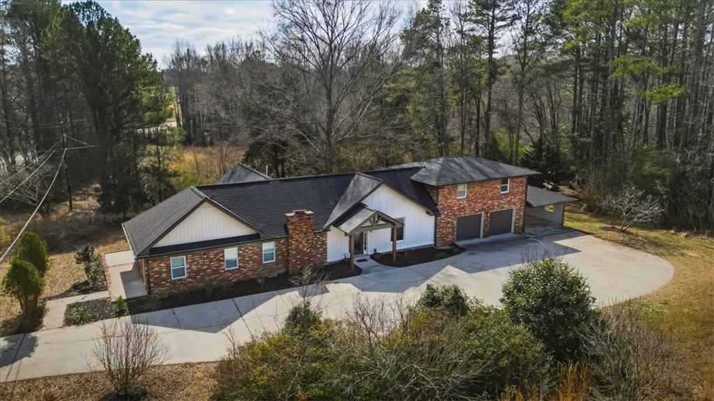 4911 Lower Jersey Road Oxford, GA 30054 - Photo 45 of 56 a front view of a house with a yard and mountain view