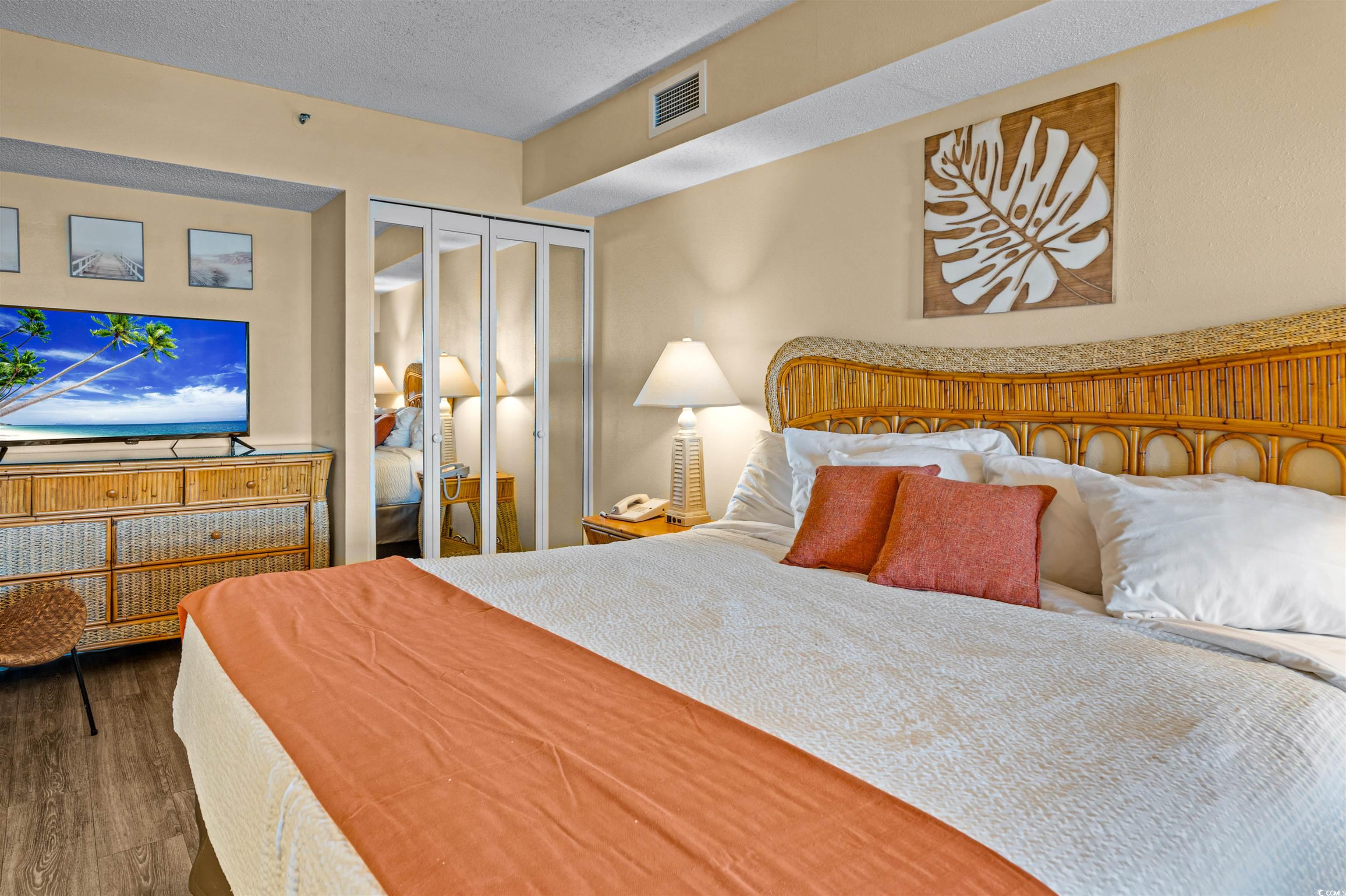 5308 North Ocean Boulevard, Unit 2006 Myrtle Beach, SC 29577 - Photo 16 of 37 Bedroom with a closet and LVP