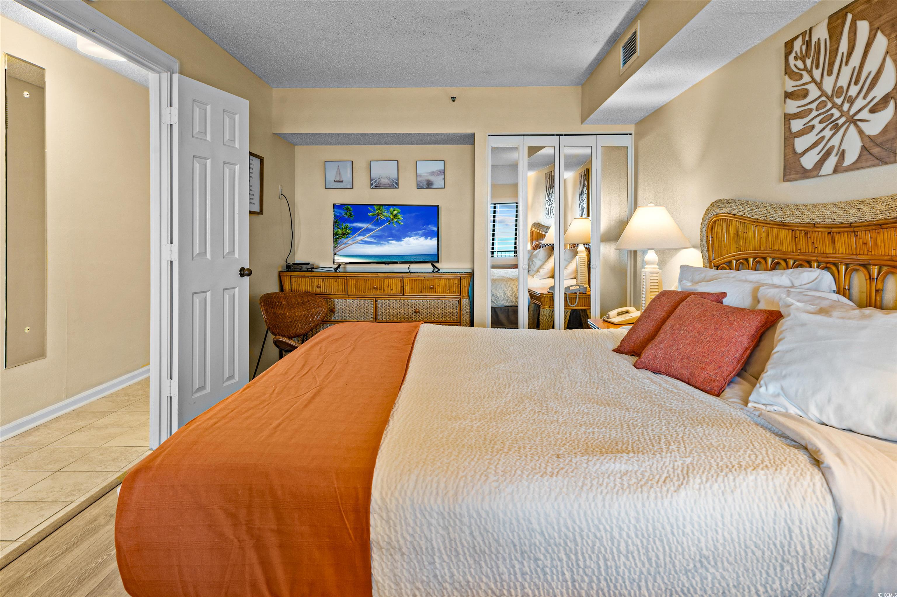 5308 North Ocean Boulevard, Unit 2006 Myrtle Beach, SC 29577 - Photo 17 of 37 Bedroom with a closet and LVP