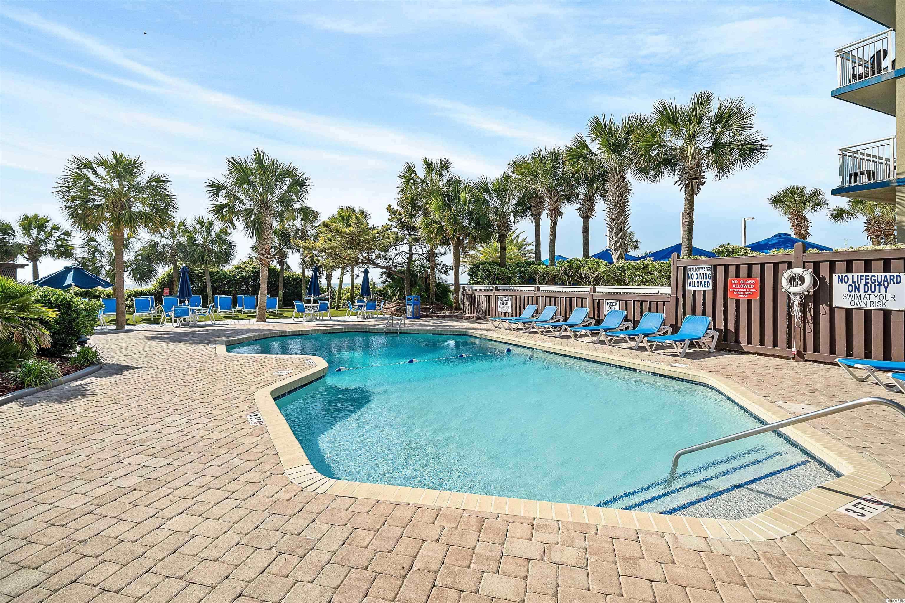5308 North Ocean Boulevard, Unit 2006 Myrtle Beach, SC 29577 - Photo 29 of 37 Community pool featuring a patio