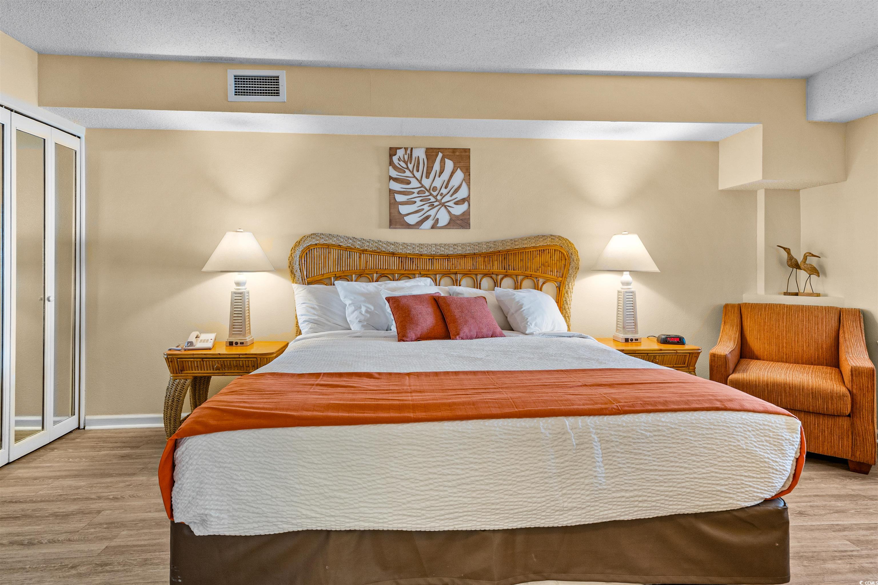 5308 North Ocean Boulevard, Unit 2006 Myrtle Beach, SC 29577 - Photo 6 of 37 Bedroom featuring ocean views and LVP flooring