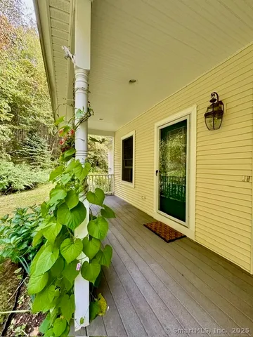 a view of a porch with wooden floor