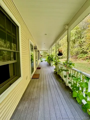 a view of balcony with wooden floor