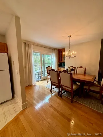 a living room with furniture a rug and a large window