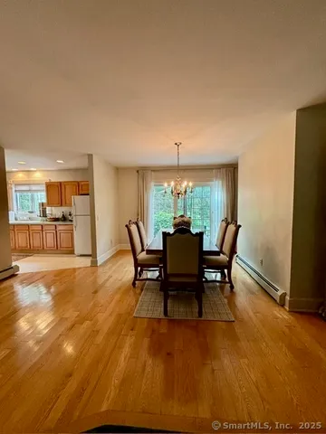 a view of a dining room with furniture and a livingroom