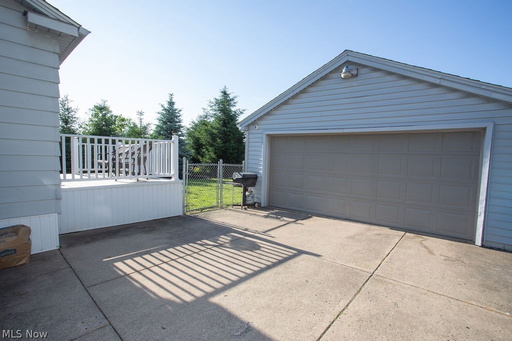 213 Como Street Struthers, OH 44471 - Photo 4 of 25 2 car detached garage with electric, storage, work bench, and new opener