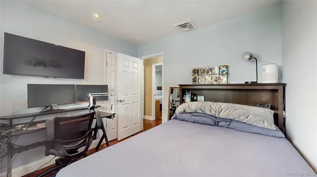 a bedroom with a bed and a table in it