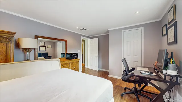 a bed room with furniture and a window