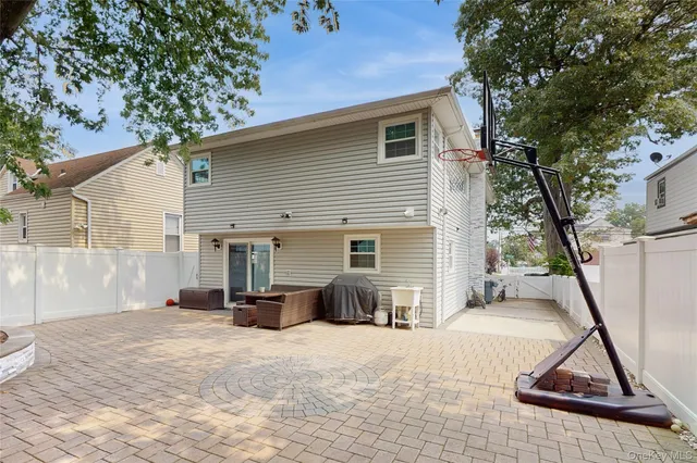 a backyard of a house with outdoor seating