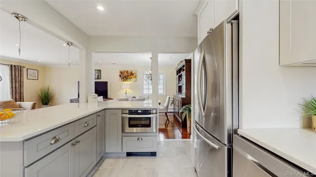 a view of a house with backyard and a tree