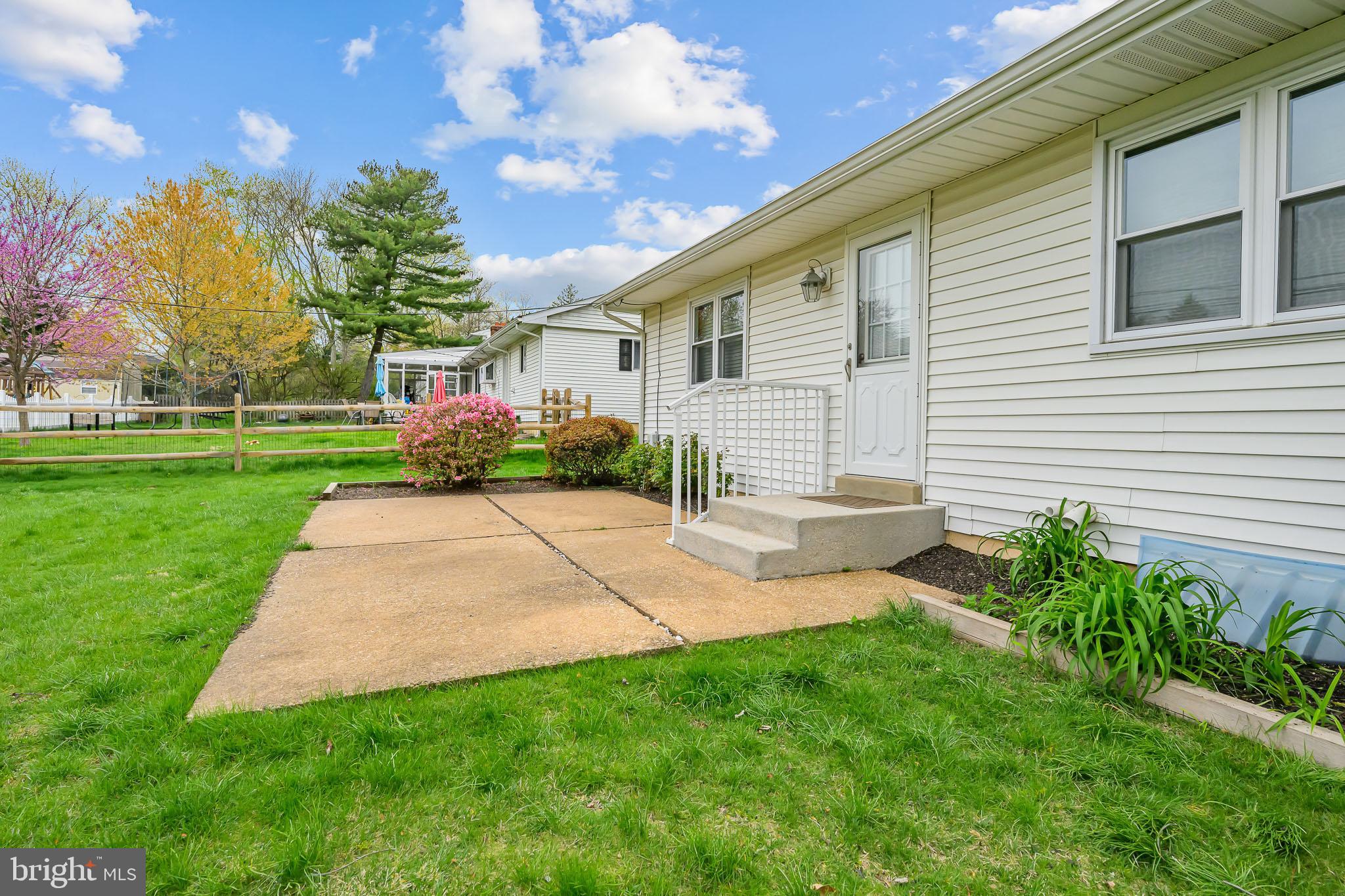 2502 Raven Road Wilmington, DE 19810 - Photo 14 of 57 a view of a backyard with plants and a garden