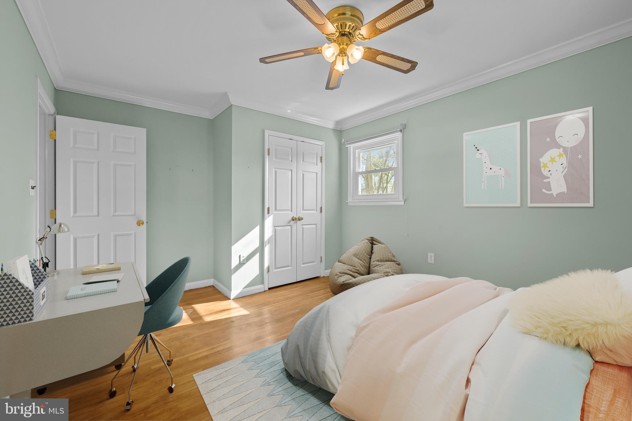 2502 Raven Road Wilmington, DE 19810 - Photo 20 of 57 a bedroom with a large bed and a chandelier