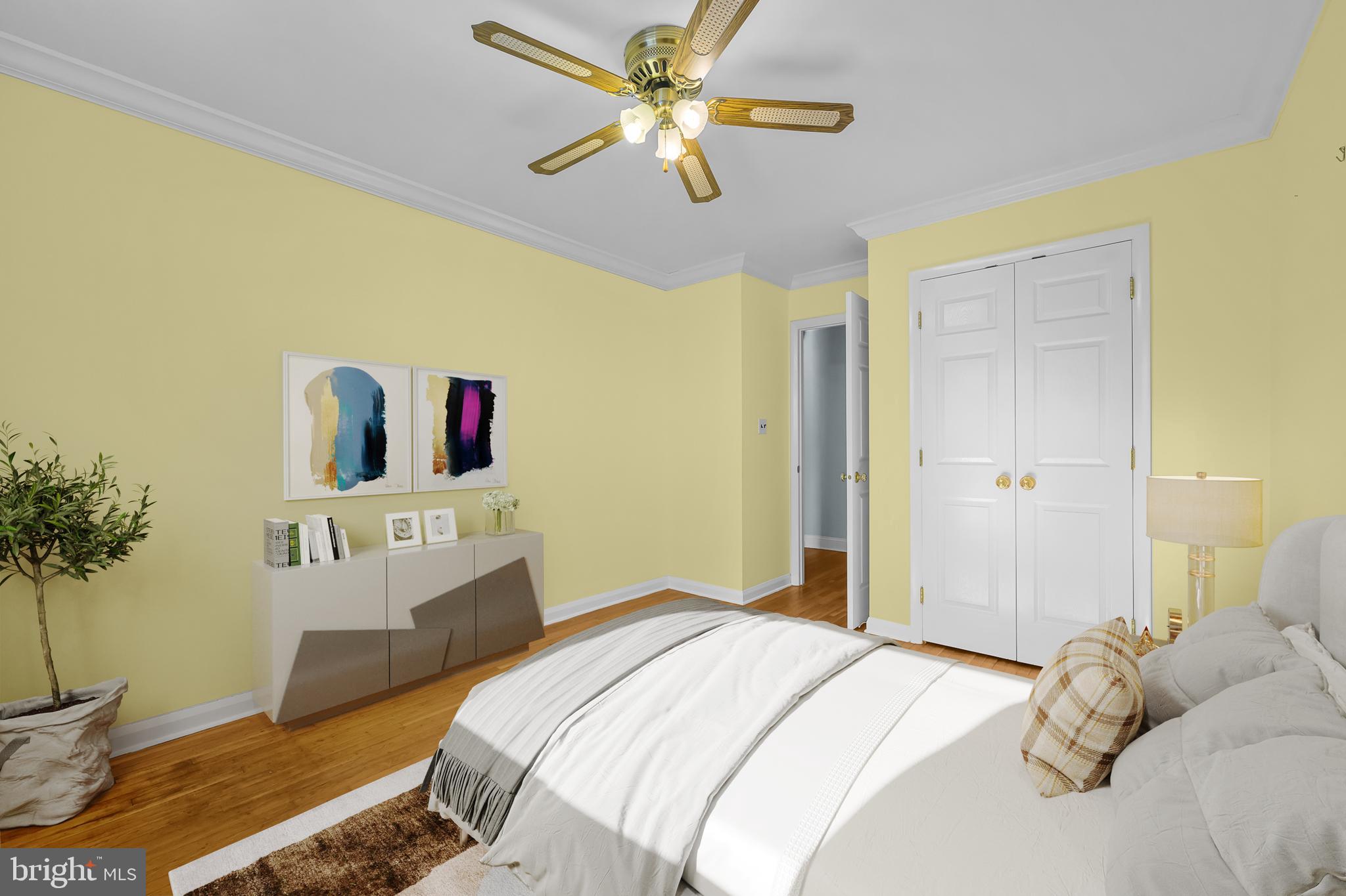 2502 Raven Road Wilmington, DE 19810 - Photo 22 of 57 a bedroom with a bed and a potted plant