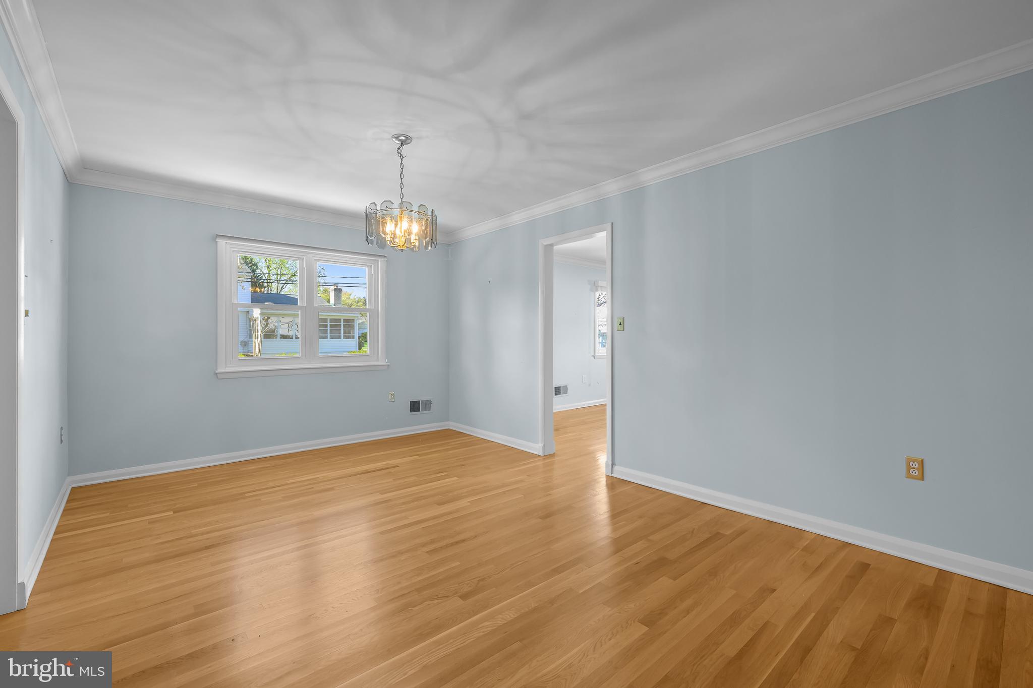 2502 Raven Road Wilmington, DE 19810 - Photo 35 of 57 a view of an empty room with window and wooden floor