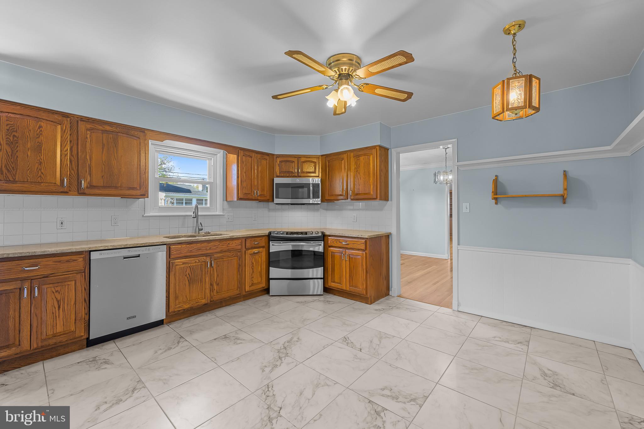 2502 Raven Road Wilmington, DE 19810 - Photo 36 of 57 a kitchen with stainless steel appliances granite countertop a sink cabinets and window