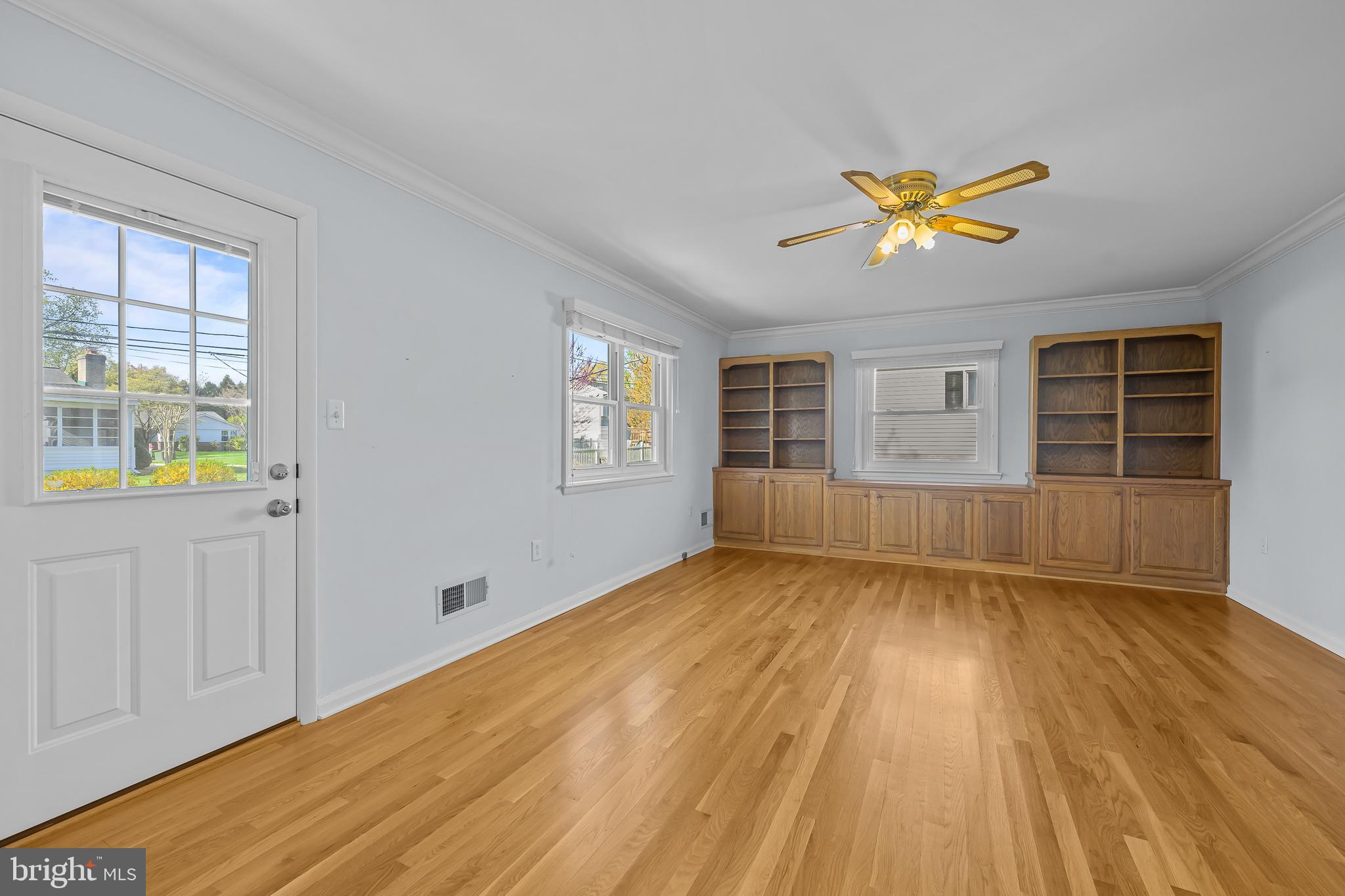 2502 Raven Road Wilmington, DE 19810 - Photo 38 of 57 a view of an empty room with a window and wooden floor