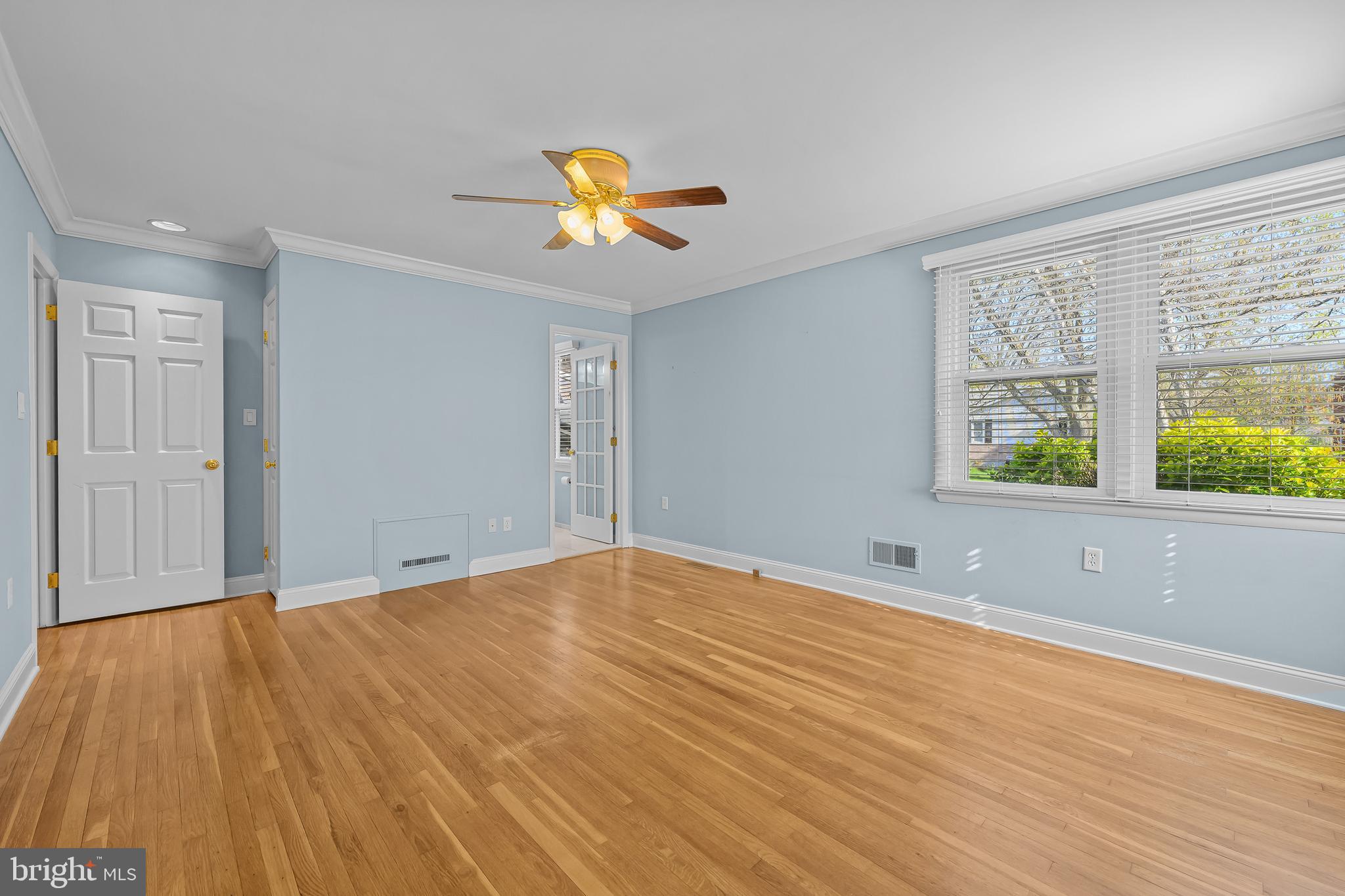 2502 Raven Road Wilmington, DE 19810 - Photo 41 of 57 a view of an empty room with window and wooden floor