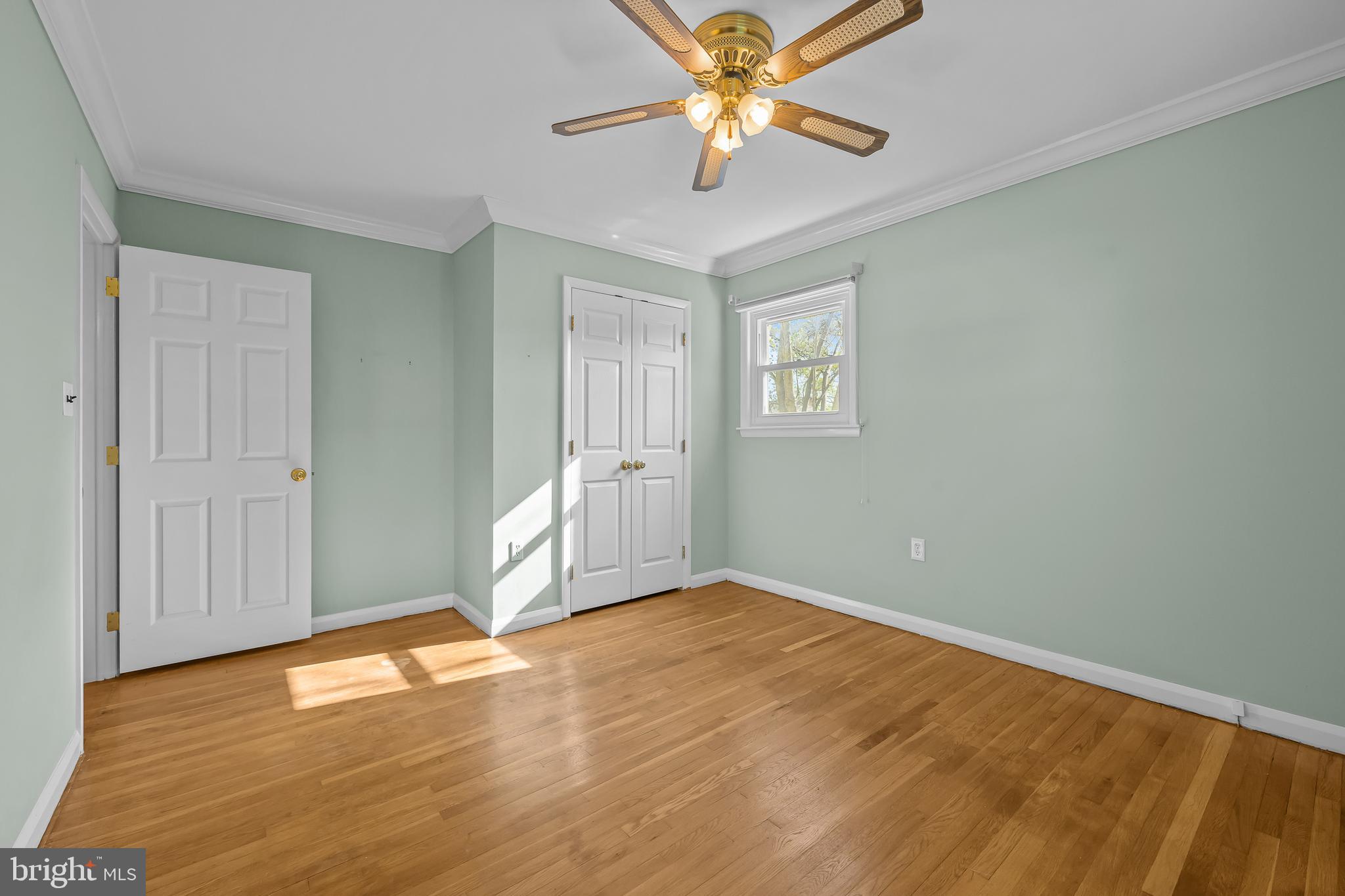2502 Raven Road Wilmington, DE 19810 - Photo 47 of 57 an empty room with wooden floor closet and windows