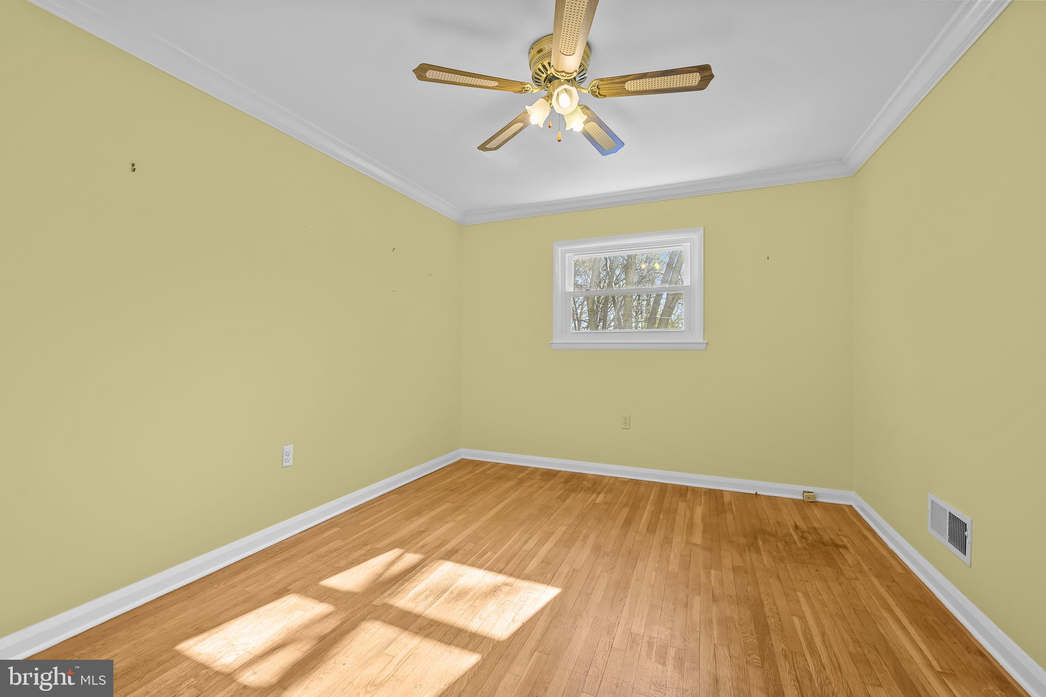 2502 Raven Road Wilmington, DE 19810 - Photo 48 of 57 an empty room with a window and ceiling fan