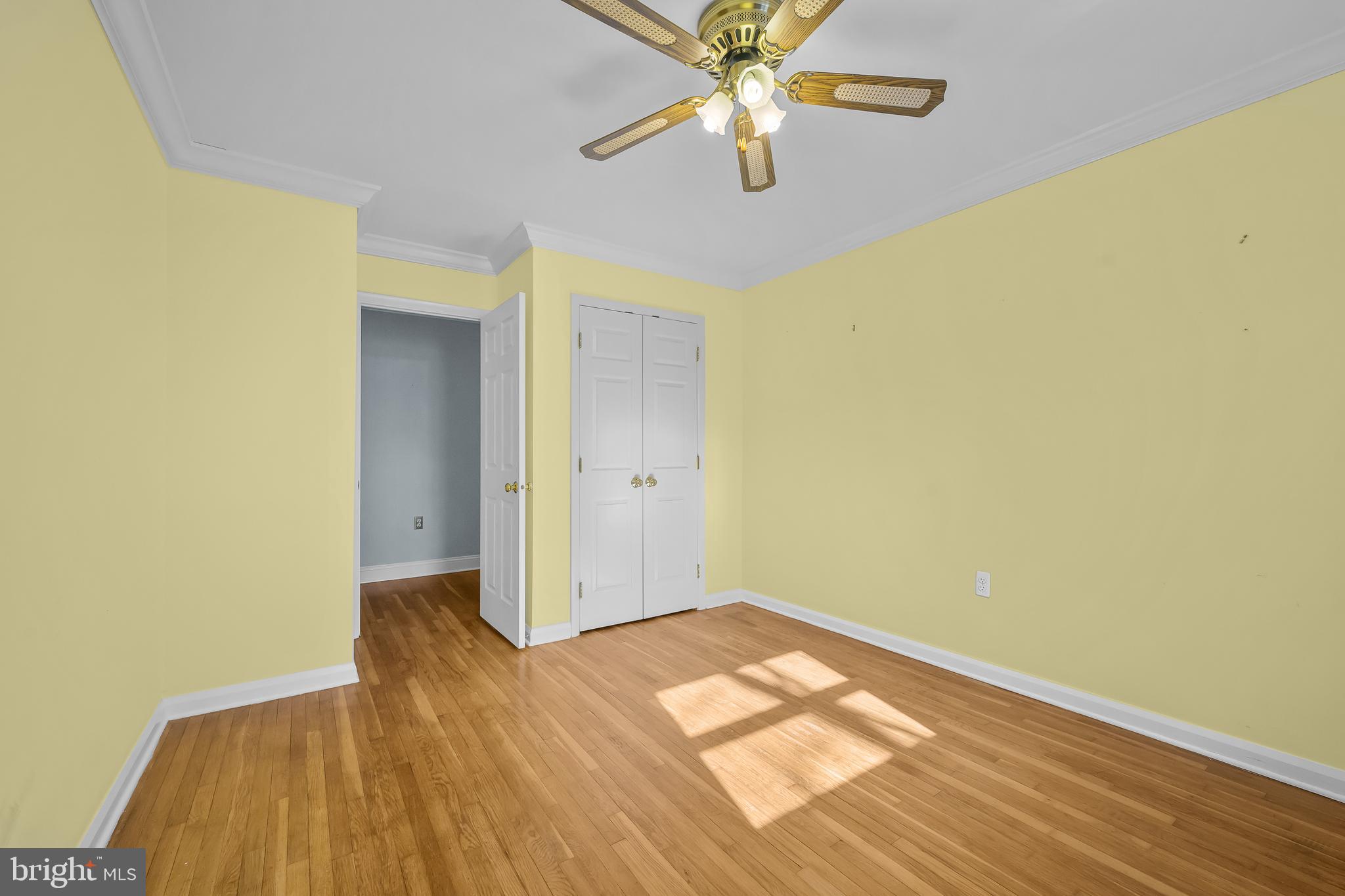 2502 Raven Road Wilmington, DE 19810 - Photo 49 of 57 an empty room with wooden floor closet and fan