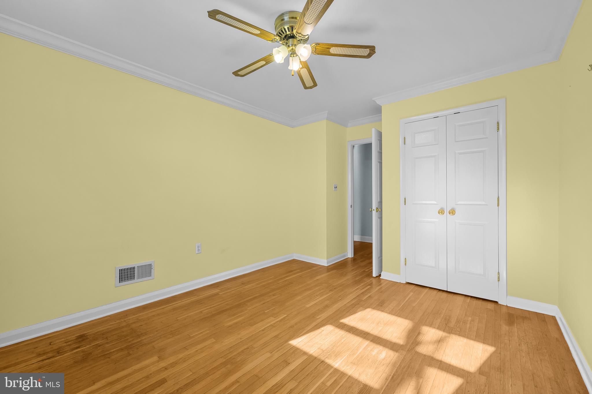 2502 Raven Road Wilmington, DE 19810 - Photo 50 of 57 a view of a big room with wooden floor and a ceiling fan