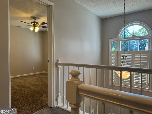 a view of a balcony with furniture
