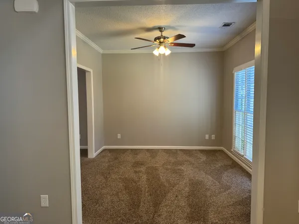 a view of an empty room with a window