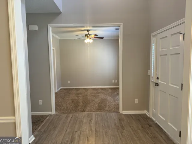 an empty room with wooden floor