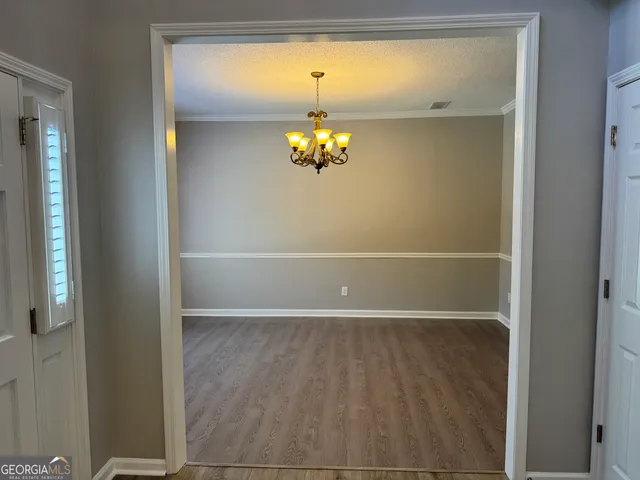 a view of a chandelier in an empty room