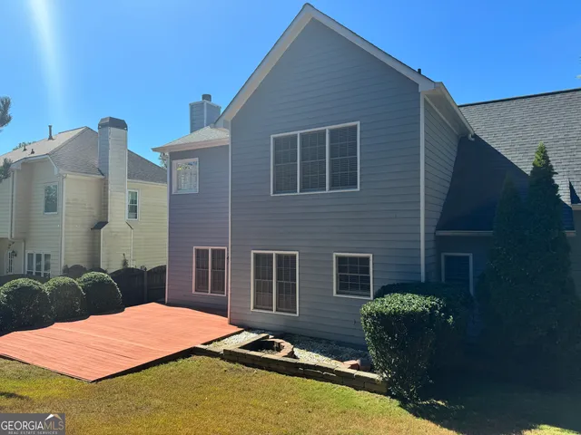 a backyard of a house with seating space