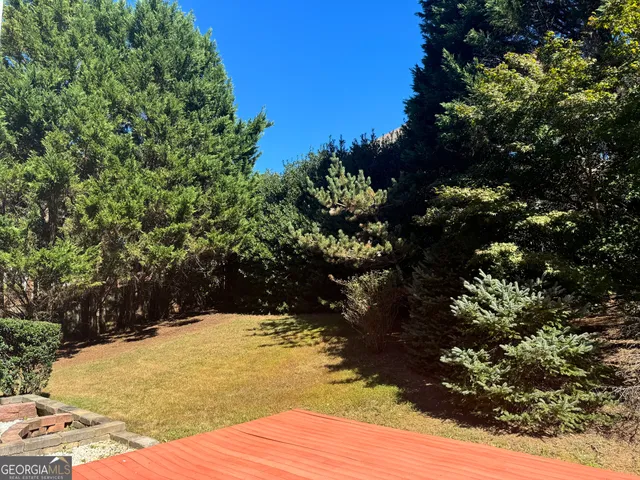 a view of a backyard of the house