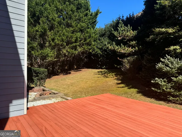 a view of a backyard of the house