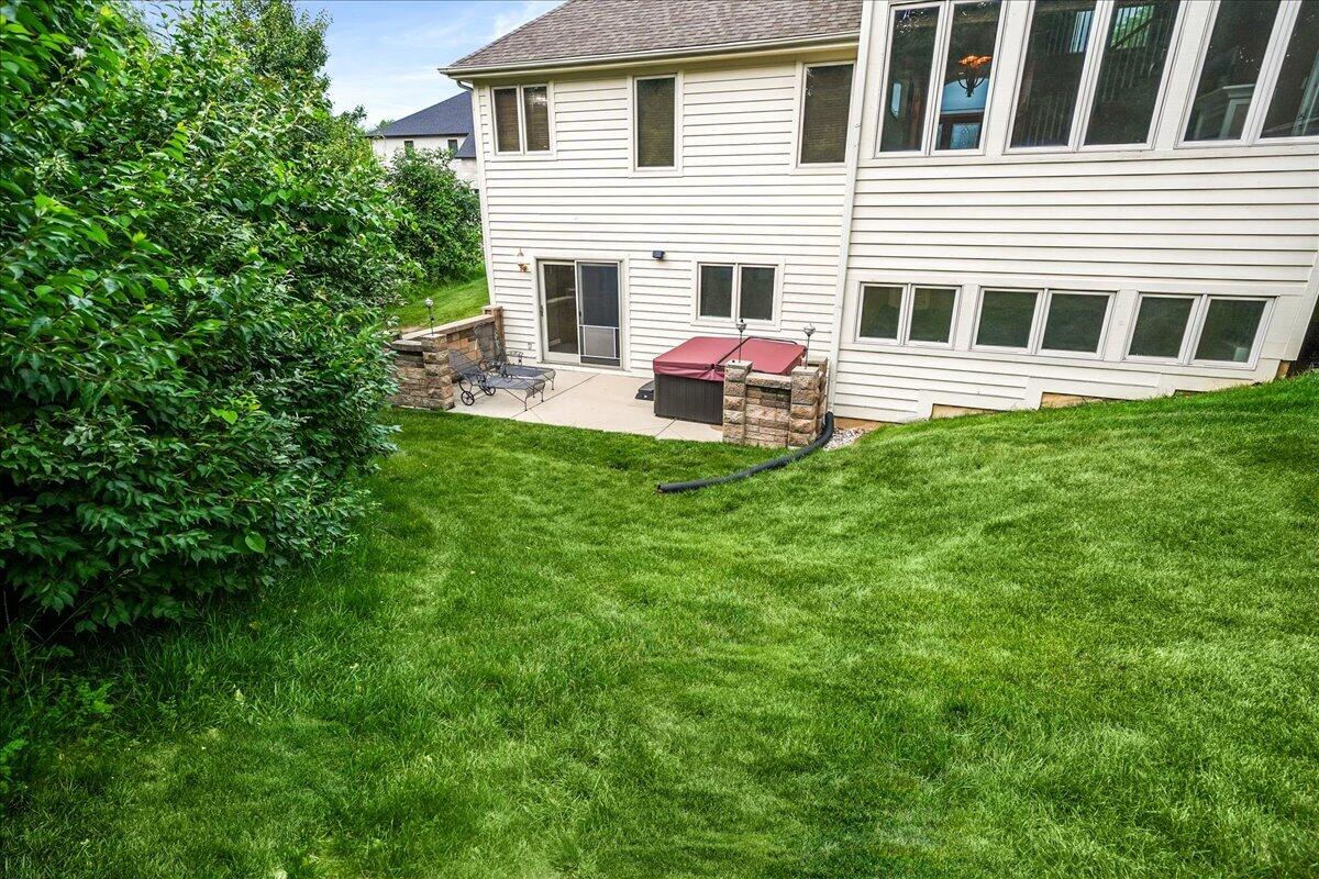 8751 Bridgewater Court Crown Point, IN 46307 - Photo 10 of 49 a view of a house with a backyard