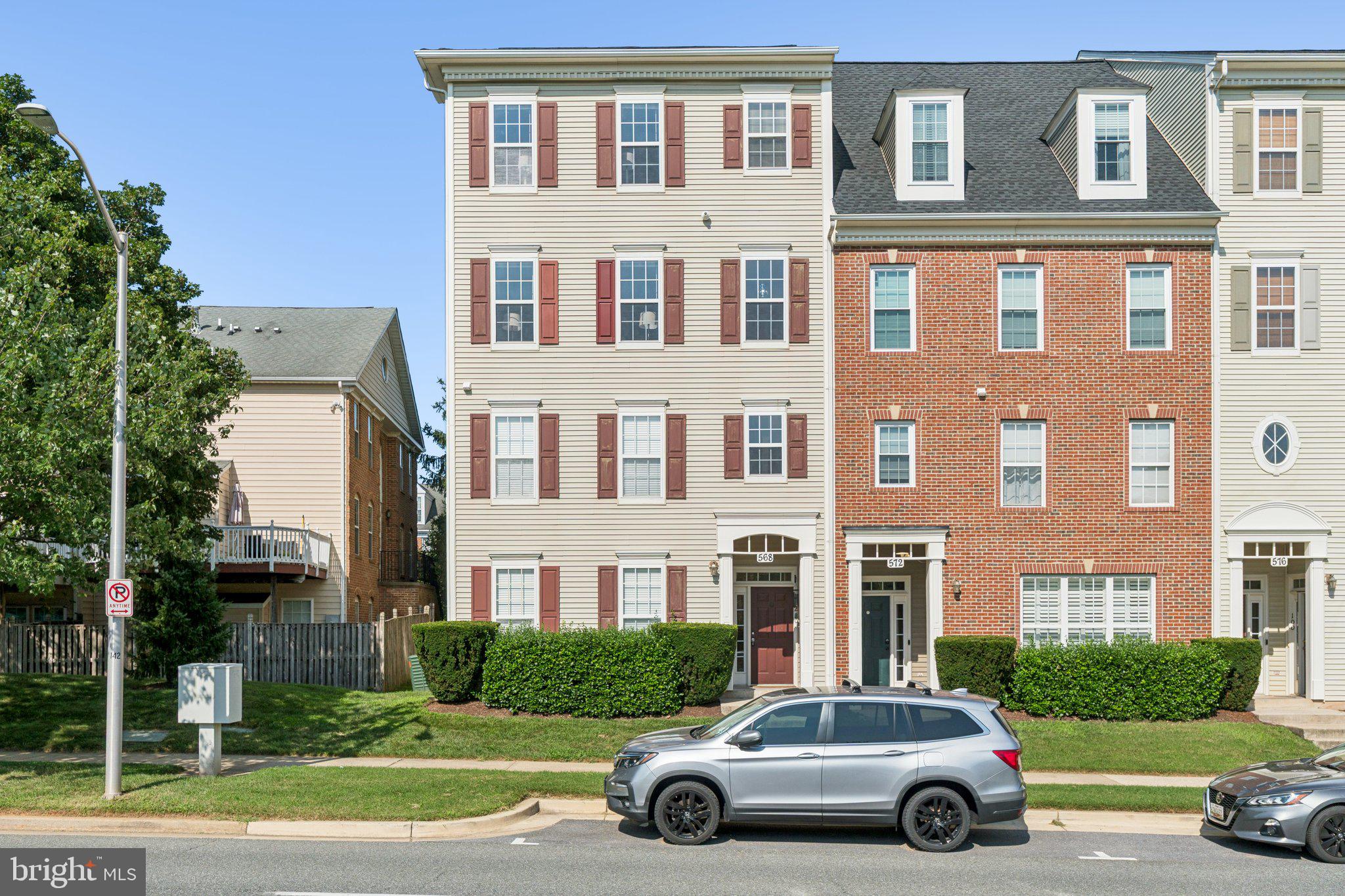 a car parked in front of a brick house