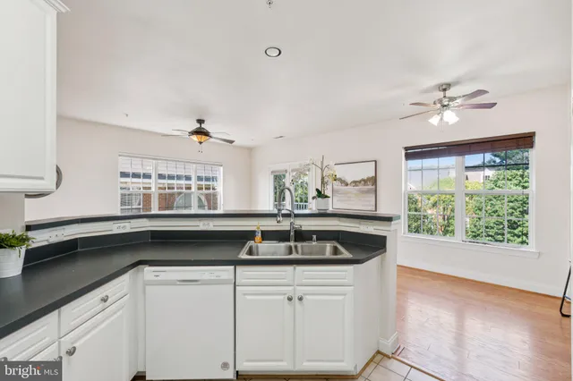 a kitchen with stainless steel appliances granite countertop a stove a refrigerator and a microwave