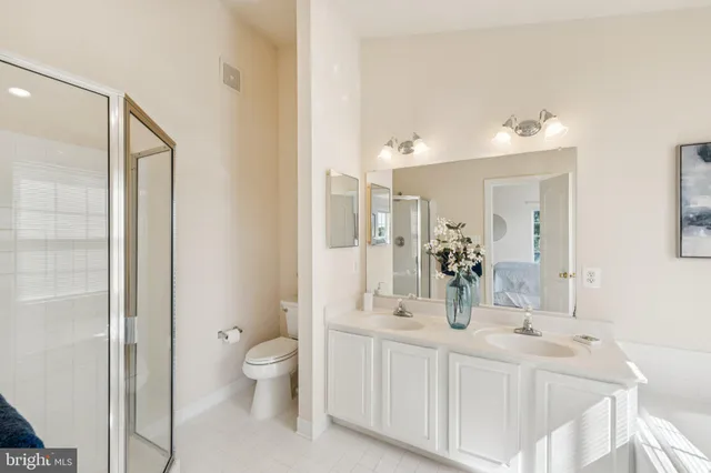 a bathroom with a bathtub sink and mirror